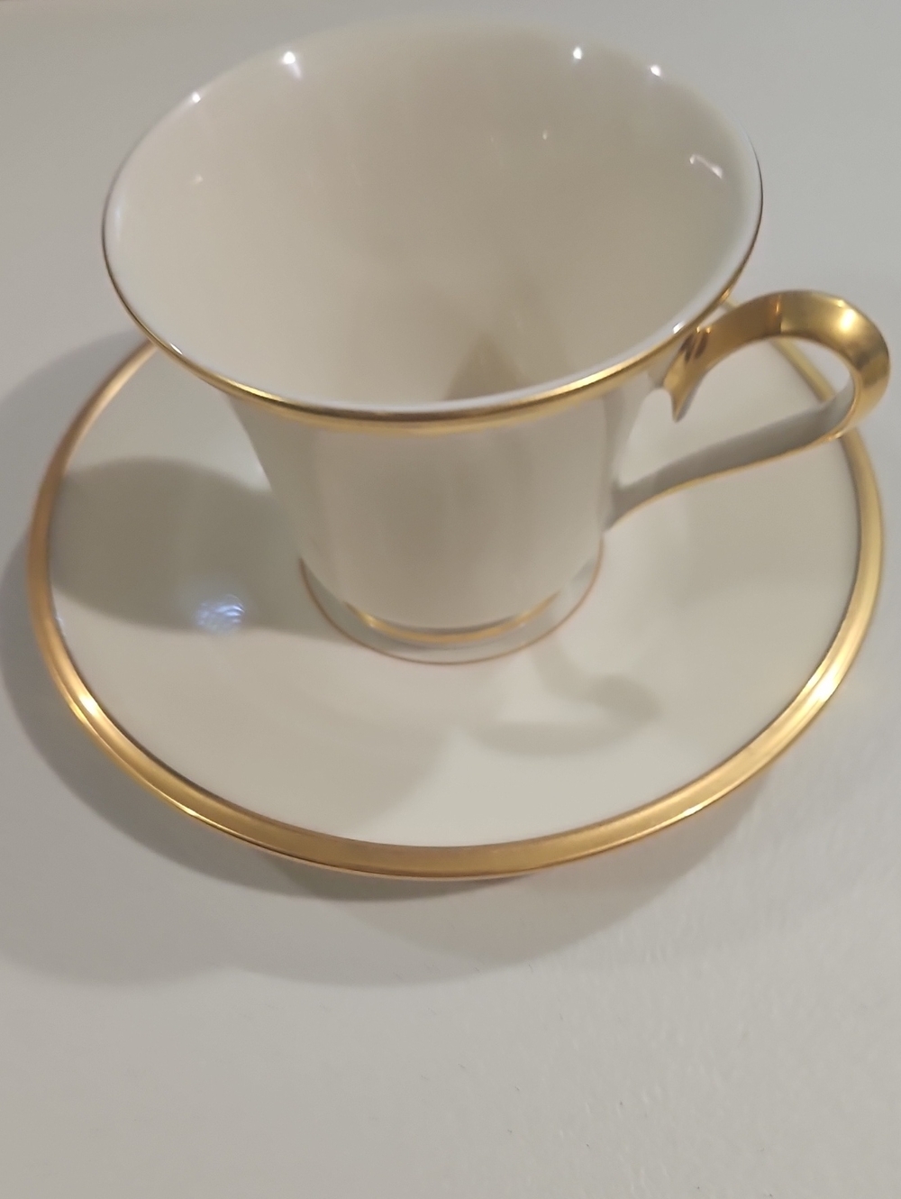 Lenox Cream Porcelain Teacup and Saucer with Gold Accent